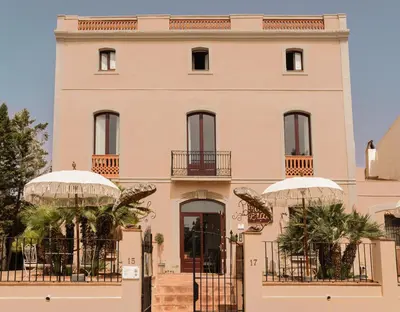a building with two domes in front of it at Hotel Palou 1874 in Sant Pere de Ribes