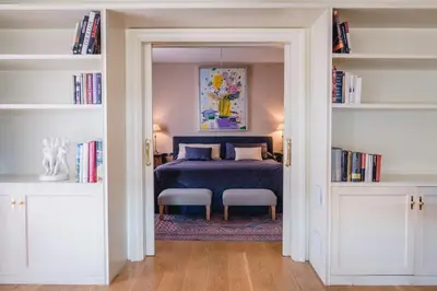 a bedroom with a bed and bookshelves at Hotel Blancafort Spa Termal in La Garriga