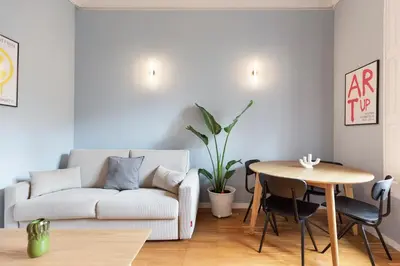 a living room with a couch and a table at Señor Urgell Apartment by Olala Homes in Barcelona