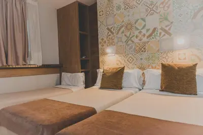 a hotel room with two beds in a room at Hostal Marenostrum in Barcelona