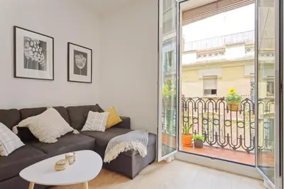 a living room with a couch and a table at CENTRAL & BRIGHT APARTMENT!! in Barcelona