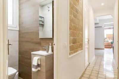 a bathroom with a sink and a toilet in it at Bright Apt with Private Terrace in Sant Antoni in Barcelona