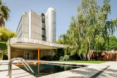 a swimming pool in front of a building at Ikonik Anglí in Barcelona