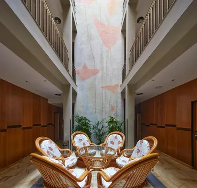 a group of chairs and a table in a room at Flor Parks in Barcelona