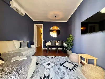a living room with a couch and a table at The Collection Barcelona - Sagrada Familia 4BD only for Families or Business groups in Barcelona