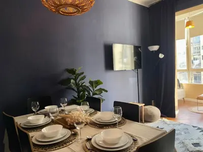 a dining room table with plates and wine glasses at The Collection Barcelona - Sagrada Familia 4BD only for Families or Business groups in Barcelona