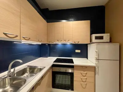 a small kitchen with a sink and a refrigerator at The Collection Barcelona - Sagrada Familia 4BD only for Families or Business groups in Barcelona
