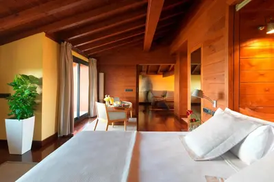 a bedroom with a bed and a dining room at Montanyà in Seva