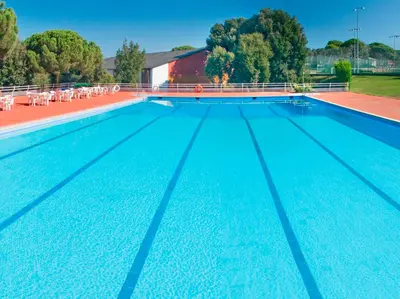 a large swimming pool with blue water at Montanyà in Seva