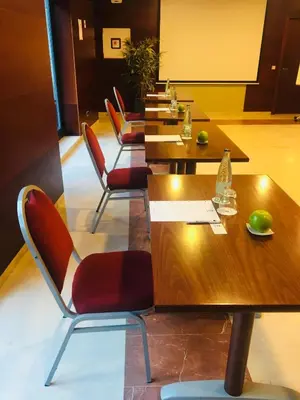a row of tables and chairs in a restaurant at Best Western Hotel Mediterraneo in Castelldefels