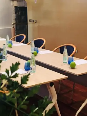 a group of tables with bottles on top of them at Best Western Hotel Mediterraneo in Castelldefels