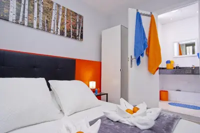 a bedroom with a bed with two flowers on it at Barcelona City Centre Hostal in Barcelona