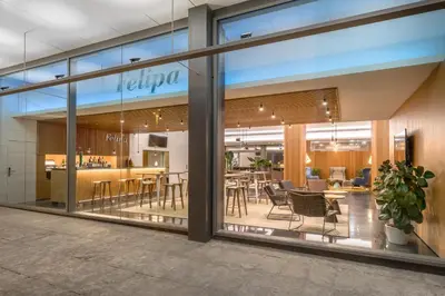 a rendering of the lobby of a store with tables and chairs at Occidental Atenea Mar - Adults Only in Barcelona