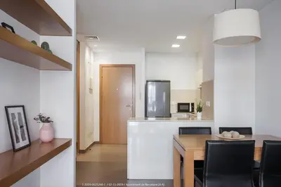 a kitchen and dining room with a table and chairs at Flateli Navas D01 in Barcelona