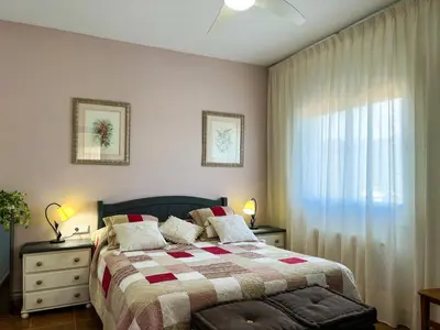 a bedroom with a bed and a window at Vivalidays Casa Ricardo in Sant Cebrià de Vallalta
