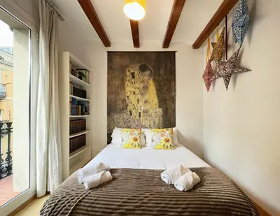 a bedroom with a large bed with two pillows at Stay U-nique Apartments Murillo in Barcelona