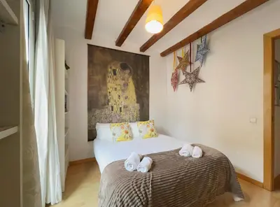 a bedroom with a bed with towels on it at Stay U-nique Apartments Murillo in Barcelona
