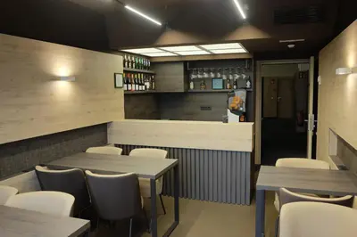 a dining room with tables and chairs in a restaurant at Aparthotel Silver in Barcelona