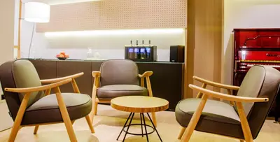 a group of chairs and a table in a salon at Aparthotel Silver in Barcelona