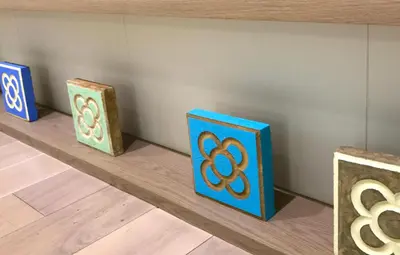 four boxes sitting on a shelf in a room at Aparthotel Silver in Barcelona