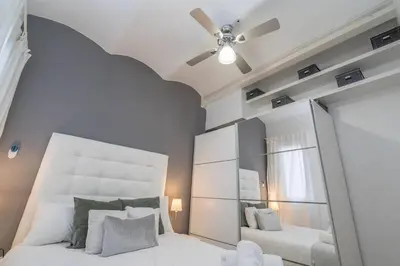 a bedroom with a large mirror and a bed at Fira BOUTIQUE by MyRentalHost in Hospitalet de Llobregat