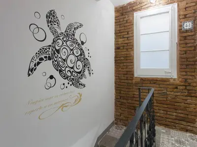 a wall with a drawing of a turtle on it at Fira BOUTIQUE by MyRentalHost in Hospitalet de Llobregat