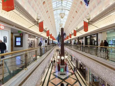 a large shopping mall with people walking in it at Fira BOUTIQUE by MyRentalHost in Hospitalet de Llobregat