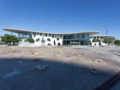 a large building with a building with a lot of debris at Colour Pop FIRA by MyRentalHost in Hospitalet de Llobregat
