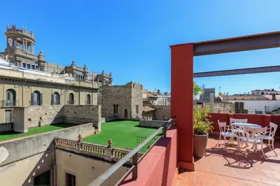 a balcony with a view of a castle at Hotel Gótico in Barcelona