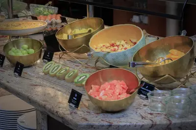 a buffet with bowls of food on a table at Hotel Gótico in Barcelona