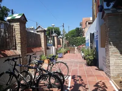 two bikes parked on the side of a brick sidewalk at Cèsar in Vilanova i la Geltrú