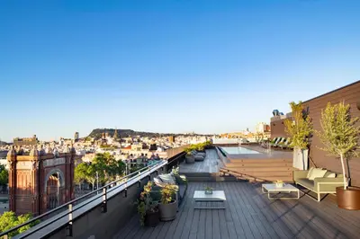 a balcony with a table and a view of a city at Archie Living in Barcelona