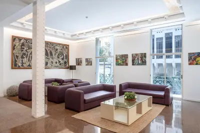 a living room with couches and a table at Gaudi Hotel in Barcelona
