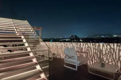 a white chair sitting on top of a roof at Gaudi Hotel in Barcelona