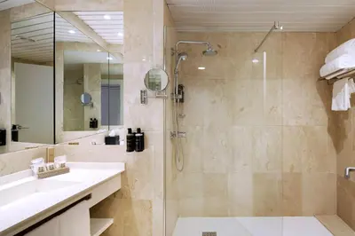 a bathroom with a shower and a sink at Eurostars Don Cándido in Terrassa