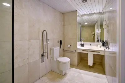 a bathroom with a toilet and a sink at Eurostars Don Cándido in Terrassa