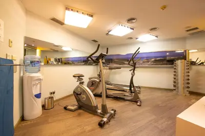a gym with a treadmill and a exercise bike at Pestana Arena Barcelona in Barcelona