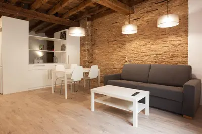 a living room with a couch and a table at Habitat Apartments Alissia in Barcelona