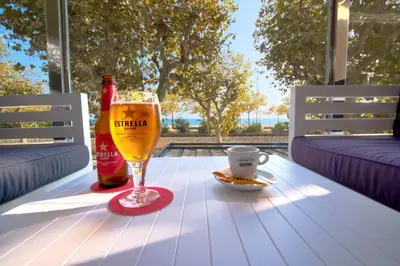 a group of chairs and tables on a patio at Hotel Internacional in Calella