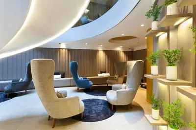 a waiting room with chairs and a couch at Hotel Condes de Barcelona in Barcelona