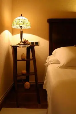 a table with candles and a heart and flowers at Hotel Golf Can Rafel in Corbera de Llobregat