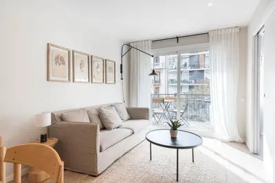 a living room with a couch and a table at Style and design in the best location, Eixample Barcelona in Barcelona