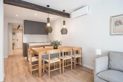 a kitchen and dining room with a table and chairs at Style and design in the best location, Eixample Barcelona in Barcelona