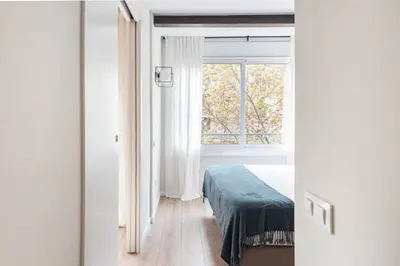 a bedroom with a bed and a window at Style and design in the best location, Eixample Barcelona in Barcelona