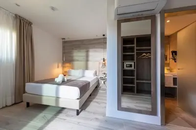 a bedroom with a bed and a large mirror at Hotel Oasis in Barcelona