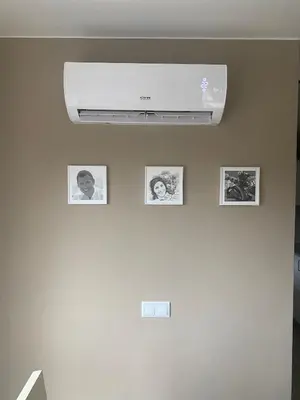 a ceiling with pictures on a white wall at Cardedeu City and Circuit apartment in Cardedeu