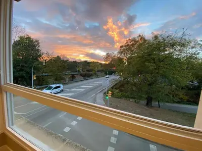 a window with a view of a road with a car at Cardedeu City and Circuit apartment in Cardedeu