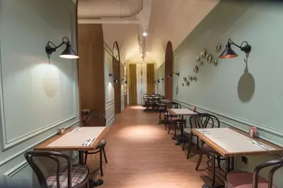 a row of tables and chairs in a restaurant at Petit Palace Boqueria Garden in Barcelona