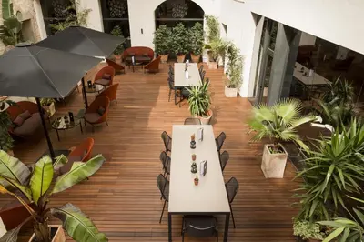 an overhead view of a restaurant with tables and chairs at Petit Palace Boqueria Garden in Barcelona