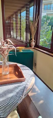 a kitchen with a table with a vase on a table at Chalet Entre Parques Naturales in Vallgorguina